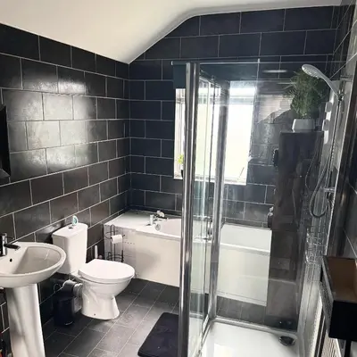 a bathroom with a sink and a toilet and a shower at Cosy Home in Chelmsford City, Free WiFi & Free Parking - Mildmay House by Stays Accommodation - Long Stays Welcome in Chelmsford