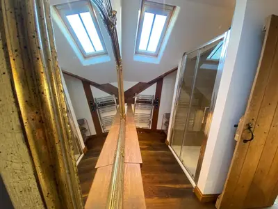 a hallway in a building with skylights at Charming 2-Bedroom Cottage in Cambridgeshire in West Wratting