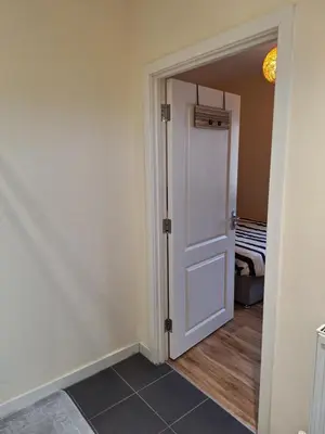 an empty room with a door and a hallway at Happy place in Milton