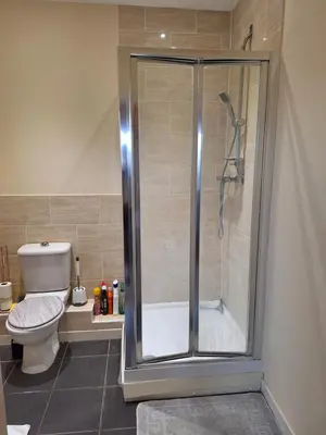 a bathroom with a shower and a toilet at Happy place in Milton