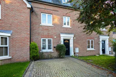 a brick house with a brick driveway in front of it at Holly Close in Ipswich