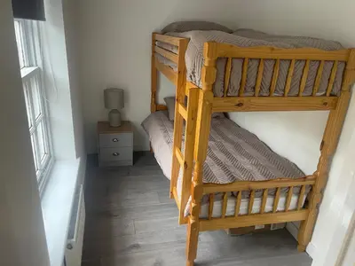 a couple of bunk beds in a room at Priory View in Saint Osyth