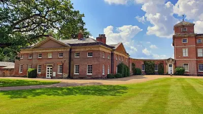 a large brick building with a large grass yard at 3 Bed in Wymondham oc-t30596 in Wymondham