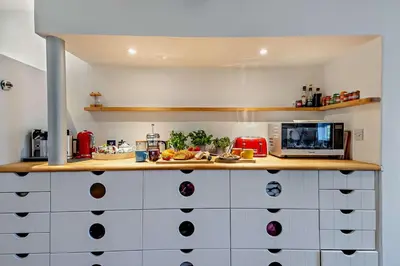 a kitchen with white cabinets and a counter top at 6 Bed in Wymondham oc-t30598 in Wymondham