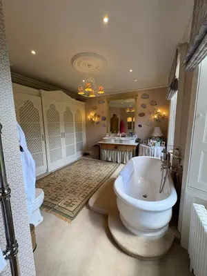 a bathroom with a large tub and a sink at Meesden Hall in Meesden
