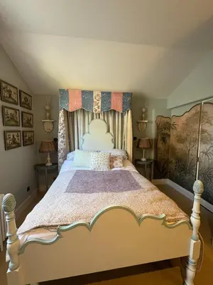 a bedroom with a large bed with a canopy at Meesden Hall in Meesden