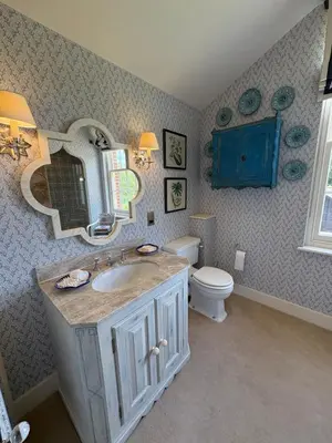 a bathroom with a sink and a toilet and a mirror at Meesden Hall in Meesden