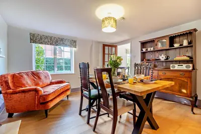 a dining room with a table and a chair at 2 Bed in Nacton oc-c30257 in Nacton