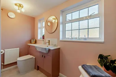 a bathroom with a sink and a mirror and a window at 2 Bed in Nacton oc-c30257 in Nacton