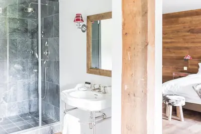 two images of a bathroom with a sink and a shower at Royal Racing Retreat in Newmarket in Newmarket