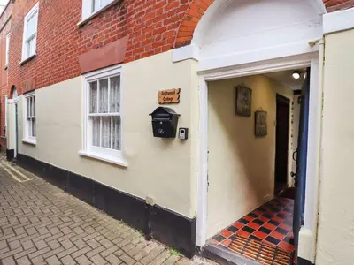 a building with a mailbox on the side of it at Driftwood Cottage in Harwich