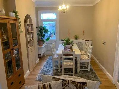 a dining room with a table and chairs at Sami in Southend-on-Sea