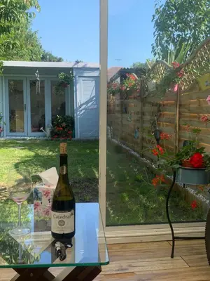 a bottle of wine sitting on a glass table at Sami in Southend-on-Sea