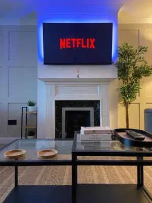 a living room with ametix sign above a fireplace at Contemporary 2-Bed House near Basildon Station in Basildon
