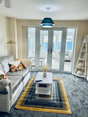 a living room with a couch and a coffee table at Spacious 3BR Home in Colchester, with Private Parking in Colchester