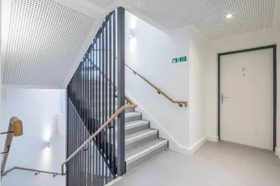 a staircase in a house with a door at Superb Central Apt With Parking in Cambridge