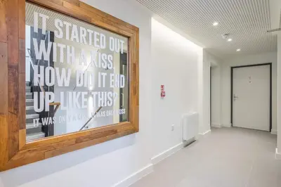 a hallway with a painting on the wall at Superb Central Apt With Parking in Cambridge