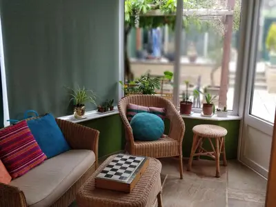 a living room with a couch and chairs and a table at Brandeston Close in Great Waldingfield