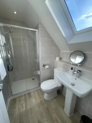 a bathroom with a toilet and a shower and a sink at Brand new prestigious house near science park in Cambridge