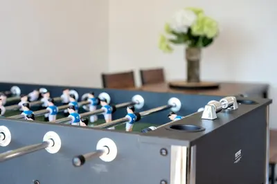 a row of blue figurines sitting on top of a machine at Chic Colchester Flat in Colchester