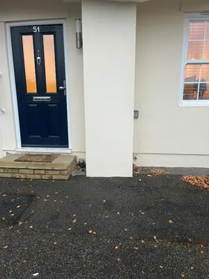 a blue front door of a white house at Lovely Central Brentwood Flat in Brentwood