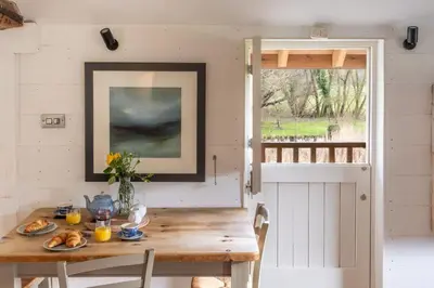 a wooden table with food on it in a room at Belchamp Hall Mill in Belchamp Otten