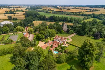 an aerial view of an estate with a mansion at Belchamp Hall Mill in Belchamp Otten