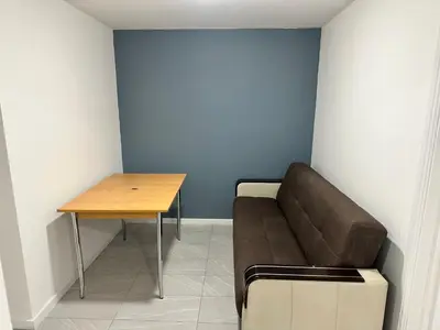 a living room with a couch and a table at Basildon Everlight Villa in Basildon