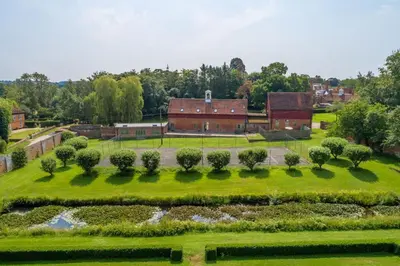 an aerial view of a garden and a barn at Belchamp Hall Hayloft and Stables in Belchamp Otten