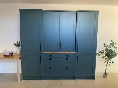 a large blue cabinet in a room with a plant at Number Forty One in Sudbury