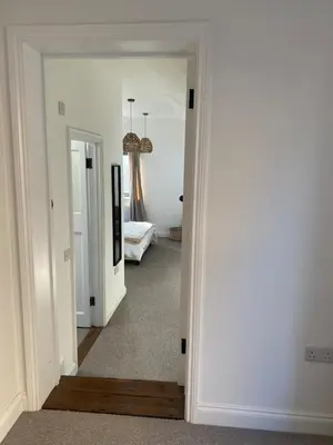 a hallway with a door leading to a bedroom at Number Forty One in Sudbury