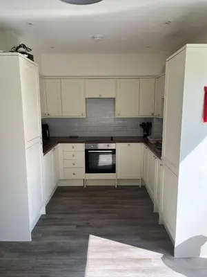 an empty kitchen with white cabinets and appliances at Seaview House with Sea View Brand New- 3 Bedrooms - Harwich, Dovercourt in Lancing