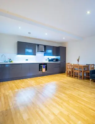 an empty room with a kitchen and a dining room at Charlotte House 2bed 2bath Retreat For 6 Guests in Ipswich