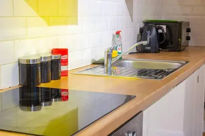 a kitchen counter top with a sink and a sink at 2br 2bath Flat In Ipswich City Centre - 6 Guests in Ipswich