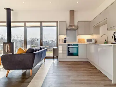 a living room with a couch and a kitchen at 2 Bed in Colchester oc-95941 in East Bergholt