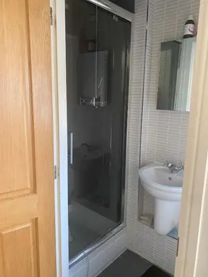 a bathroom with a shower and a sink at Cosy room in Faulkbourne