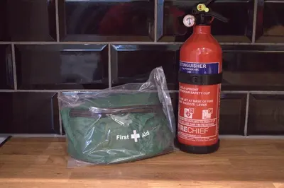 a fire hydrant next to a bag and a fire extinguisher at Luxury 3 bedroom house in Harlow, Essex in Harlow