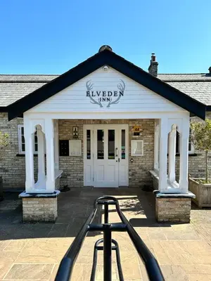 a building with a sign that readswagenezer on it at Elveden Inn in Elveden
