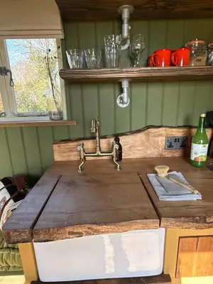 a kitchen counter with a sink and a sink at 'Russet' Hut on fruit farm in Charsfield