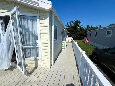 a porch with a door open on a house at Lovely 6 Berth Caravan With Decking At Suffolk Sands Holiday Park Ref 45005Hc in Felixstowe