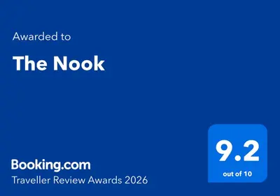 a blue screen with the words awarded to the nokok traveller review awards at The Nook in Great Cornard