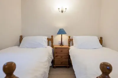 two beds sitting next to each other in a room at Varley House, Saxmundham in Saxmundham