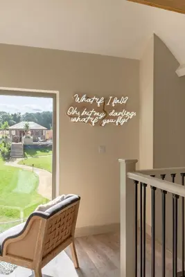 a sign on a wall in a room with a chair at 5 Bed in Cowlinge oc-t27606 in Cowlinge