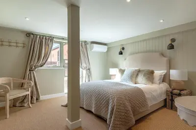 a bedroom with a bed and a window at 5 Bed in Cowlinge oc-t27606 in Cowlinge