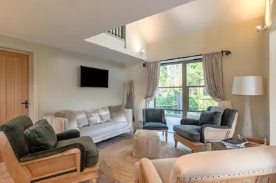 a living room with couches and chairs and a tv at 5 Bed in Cowlinge oc-t27606 in Cowlinge