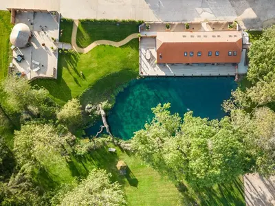 an overhead view of a building and a body of water at 5 Bed in Cowlinge oc-t27606 in Cowlinge