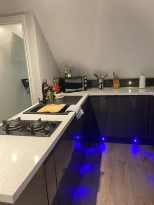 a kitchen with a stove and a counter top at Primrose Lodge in Maldon in Maldon
