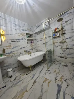 a bathroom with a bath tub and a sink at One Bed and Bath in Rochford in Rochford