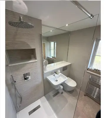 a bathroom with a toilet and a sink and a shower at Detached Luxury Coach House - Sky Sports Cinema - EVCharger in Colchester