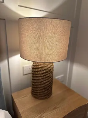 a lamp on top of a wooden table with a lamp at Detached Luxury Coach House - Sky Sports Cinema - EVCharger in Colchester